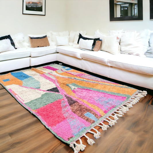 Full view of a handwoven abstract geometric Beni Ourain Moroccan rug with bold, colorful shapes and a plush texture.