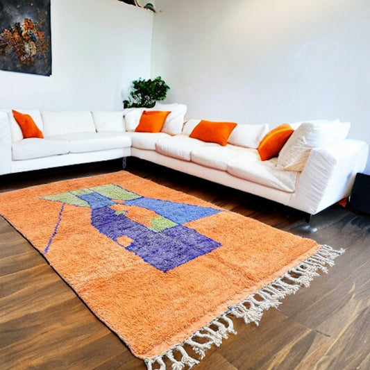 Full view of a handwoven orange geometric block Beni Ourain Moroccan rug with bold color blocks and a plush texture.