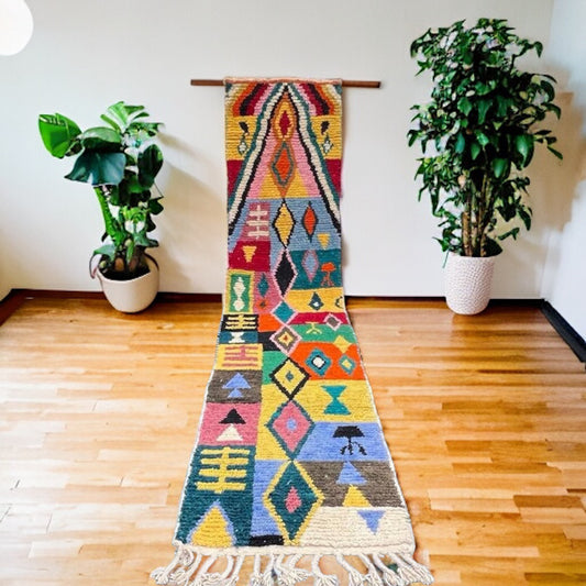Full view of a handwoven colorful geometric Beni Ourain Moroccan runner rug with bold blocks of color.