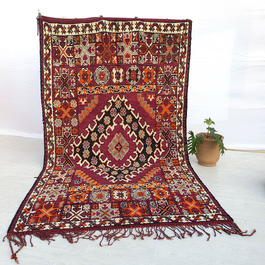 Full view of a plum handwoven wool Boujaad Moroccan rug with a diamond pattern