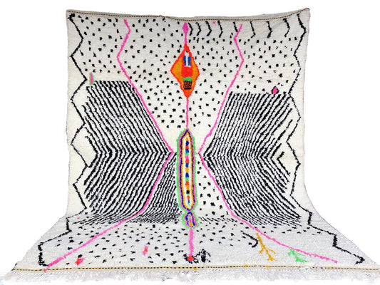 Full view of a handwoven graphic diamond Azilal Moroccan rug with bold black patterns and vibrant color accents.